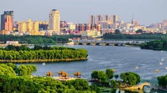 A river and Changchun City in the background